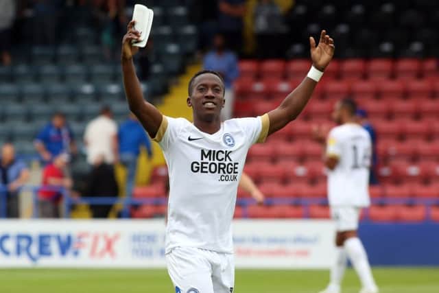 Siriki Dembele celebrates the Posh win at Rochdale at full-time. Photo: Joe Dent/theposh.com.