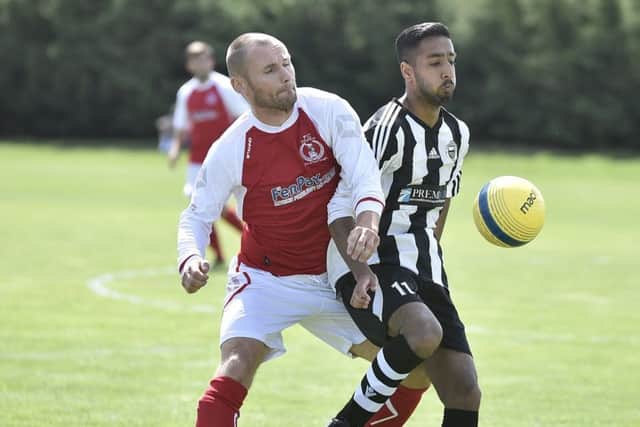 Action from Peterborough Polonia's win over Langtoft United (stripes). Photo: David Lowndes.