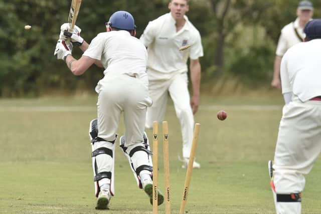 Liam Smith of Sawtry is bowled by Freddie Ansty of Laxton in yesterday's Rutland Division Four game. Photo: David Lowndes.