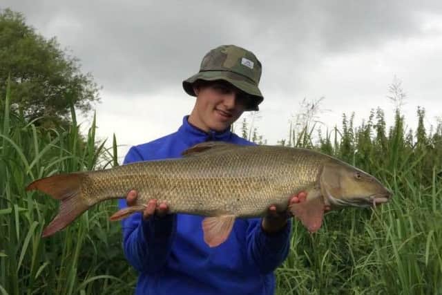 Oliver Rogers with his 11lb barbel.