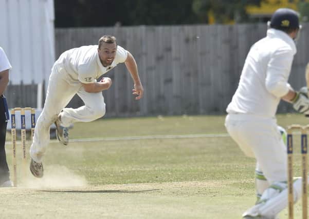 Jamie Smith bowling for Peterborough Town against Geddington last weekend. Photo: David Lowndes.