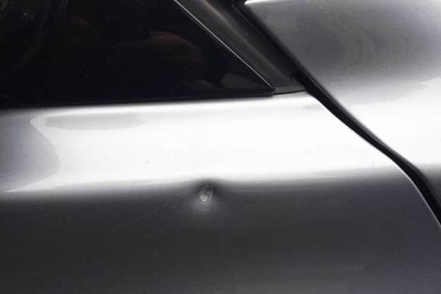 The dent in Mr Nash's car