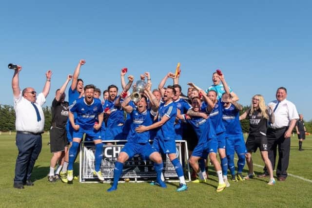 Yaxley FC celebrate their United Counties Premier Division title.