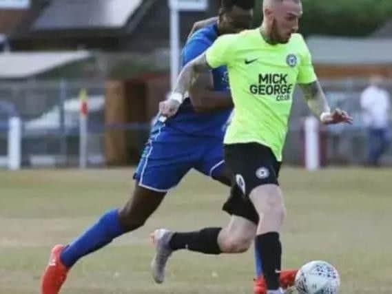 Marcus Maddison in action for Posh