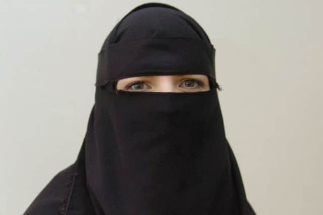 A woman wearing a Burka