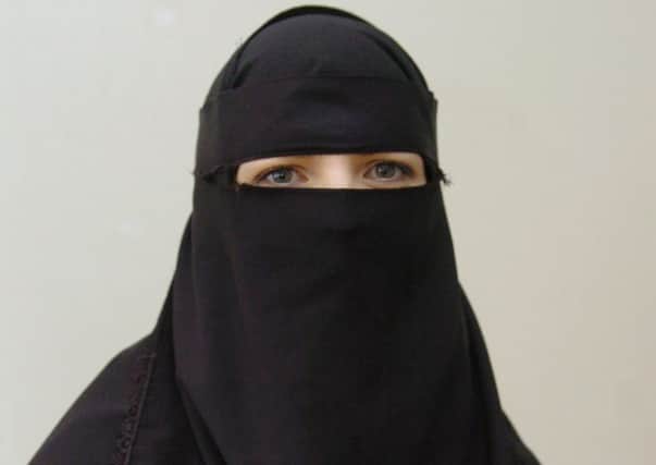 A woman wearing a Burka