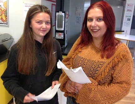 Megan Burkitt and Tayla-Mai Tomlinson with their results
