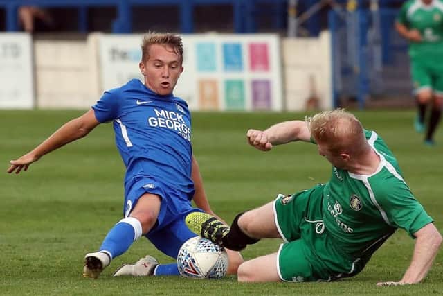 Louis Reed (left) could start for Posh against Luton.
