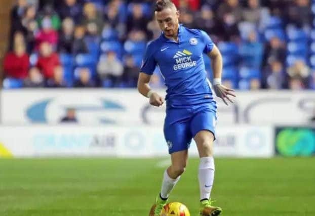Marcus Maddison in action for Posh