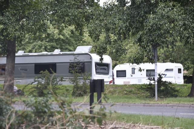 Travellers outside The Maples, Orton Goldhay. EMN-180817-152410009