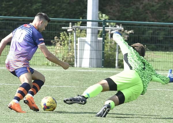 Dan Cotton on the attack for Yaxley against Barton Rovers. Photo: David Lowndes.