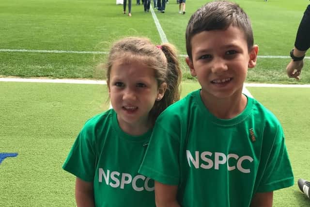 Young NSPCC and Posh supporters, five-year-old Ruby Markillie and her six-year-old brother Calan,