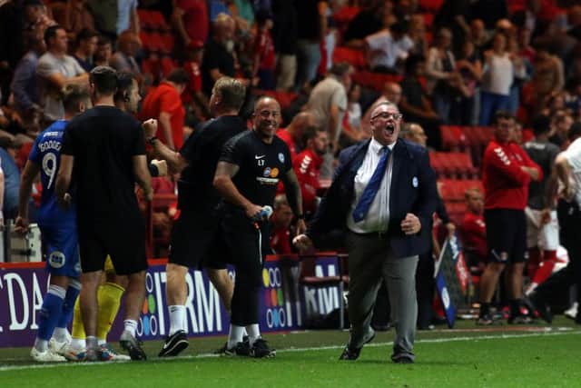 Steve Evans celebrates Posh's victory at Charlton. Photo: Joe Dent/theposh.com.