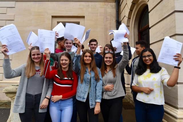 Pupils at The Peterborough School pick up their results