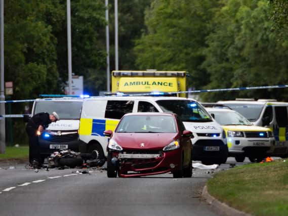 Police at the scene of the crash in Bretton Way. Photo: Terry Harris