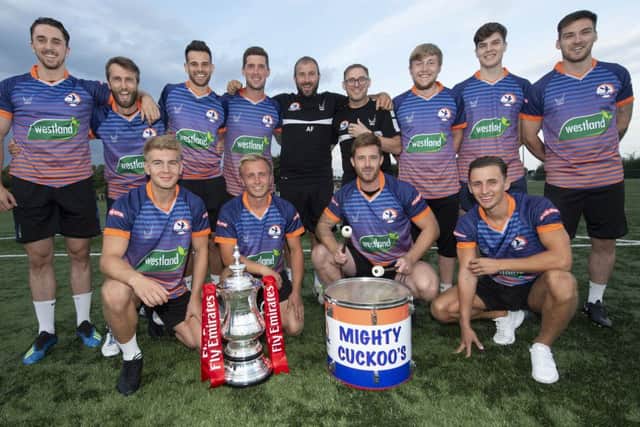 Yaxley manager Andy Furnell and some of his players are pictured with the Emirates FA Cup. The trophy was at In2itive Park yesterday for photo opportunties. Photo: Alan Walter