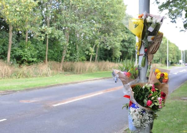 Flowers  at the scene of a  fatal collision at Deerleap, South Bretton.