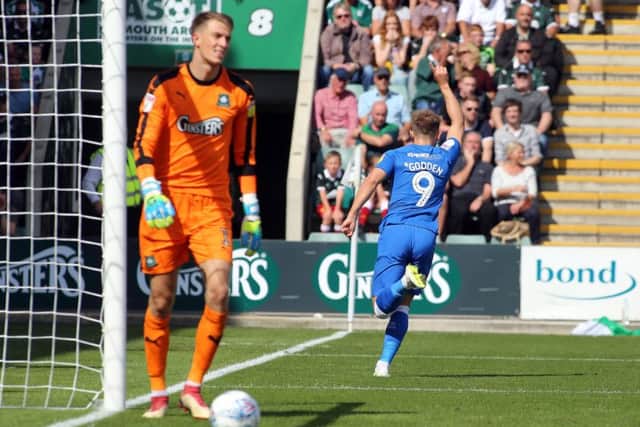 Matt Godden of Peterborough United wheels away to celebrate scoring the opening goal. Picture: Joe Dent