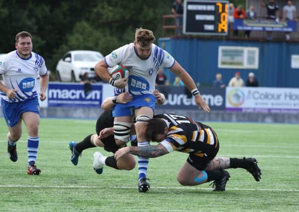 Tom Lewis drives forward for the Lions in last weekend's game against Welsh champions Merthyr. Picture: Mick Sutterby