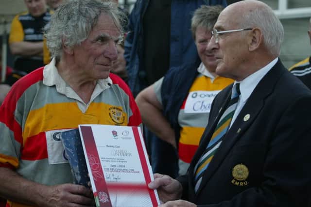 Benny Lee receives an RFU Volunteer Award from Derek Watkins.