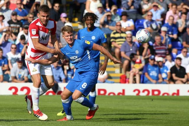 Mark O'Hara of Peterborough United in action with Andrew Butler of Doncaster Rovers - Mandatory by-line: Joe Dent/JMP - 01/09/2018 - FOOTBALL - ABAX Stadium - Peterborough, England - Peterborough United v Doncaster Rovers - Sky Bet League One