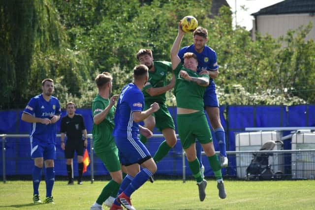 Handball in the penalty area by a Kidlington defender during their 4-0 defeat at Peterborough Sports. Photo: James Richardson.