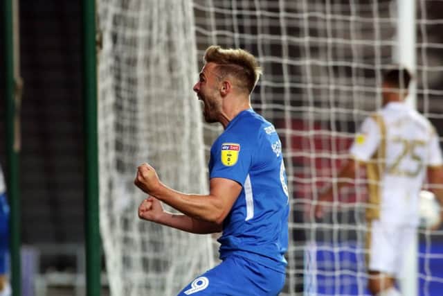 Matt Godden celebrates his Posh equaliser at MK Dons. Photo: Joe Dent/theposh.com.