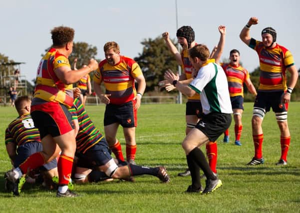 Borough celebrate scoring a try in their win against Old Scouts.