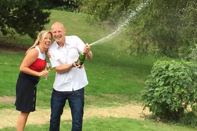 Daniel and Charlotte Peart celebrate their lottery win today in Peterborough