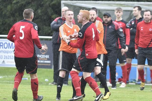 Adam Scott (orange, centre) misses Thorney's game with Moulton Harrox.