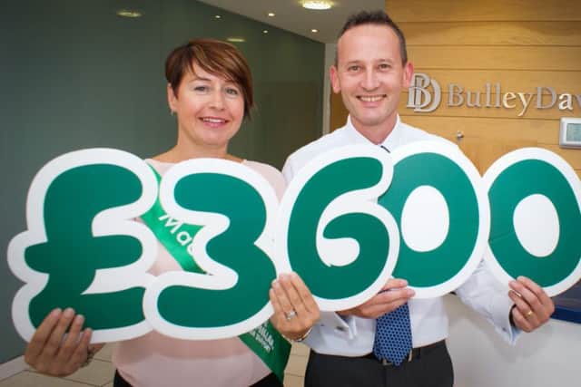 Mike Gregson, Director at Bulley Davey, and Michelle Hutchinson, local Fundraising Manager from Macmillan Cancer Support.