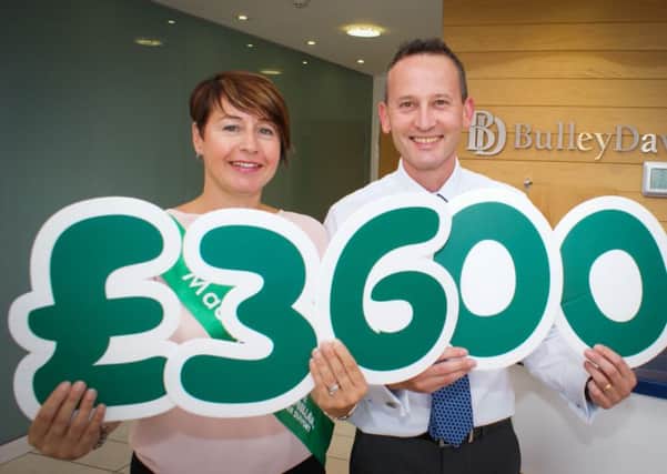 Mike Gregson, Director at Bulley Davey, and Michelle Hutchinson, local Fundraising Manager from Macmillan Cancer Support.