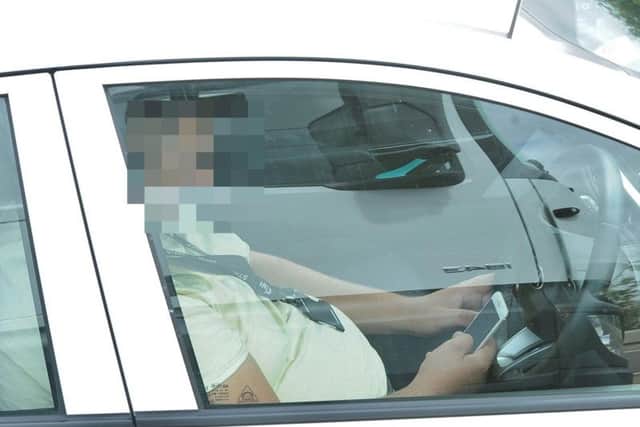 A driver caught on his phone