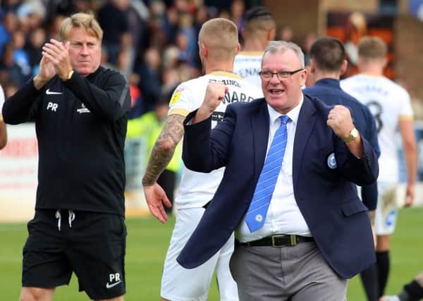 Peterborough United Manager Steve Evans celebrates his side's win at full-time. Picture: Joe Dent