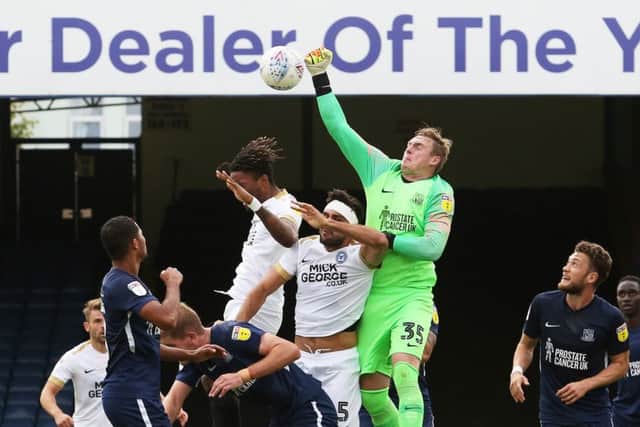 Southend 'keeper David Stockdale punches clear under pressure in Posh's 3-2 win at Southend. Photo: Joe EDent/theposh.com.