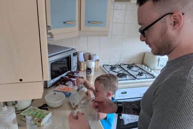 Lincoln and Jamie Hanley preparing the food for the rough sleepers