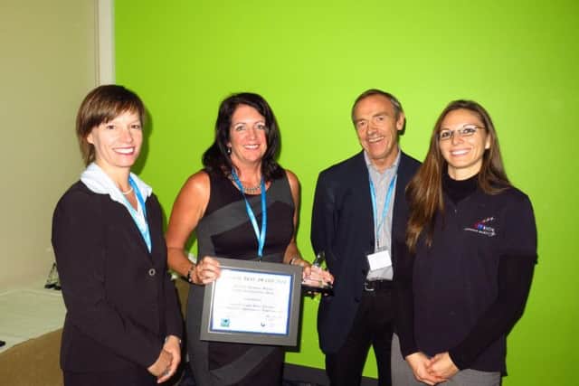 Sue Addison, second from left, in Norway proudly receiving the Gold Global Best Award in 2016.