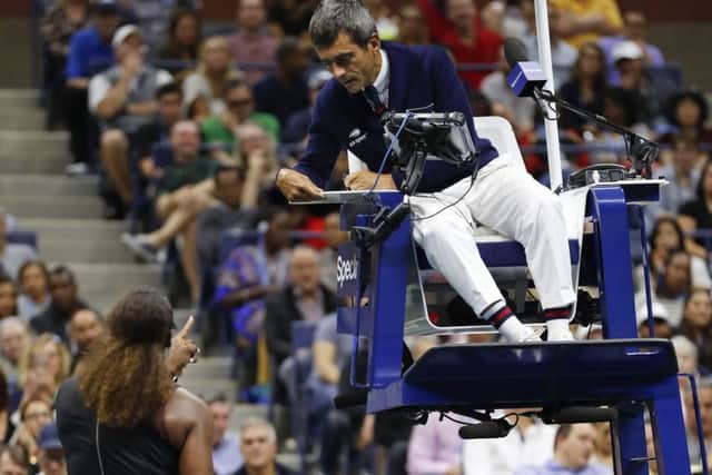 Serena Williams converses with umpire Carlos Ramos during the US Open Tennis Final.