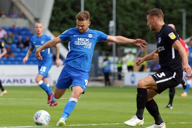 Posh striker Matt Godden takes a shot at the Portsmouth goal. Photo: Joe Dent/theposh.com.