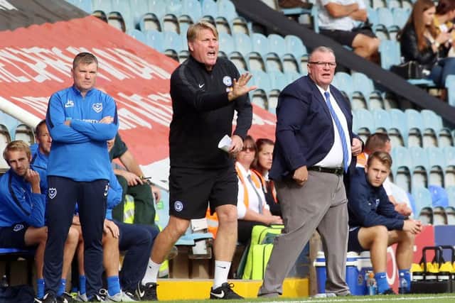 Posh boss Steve Evans and his assistant Paul Raynor urge their players on against Portsmouth. Photo: Joe Dent/theposh.com.