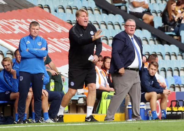 Posh boss Steve Evans and his assistant Paul Raynor urge their players on against Portsmouth. Photo: Joe Dent/theposh.com.