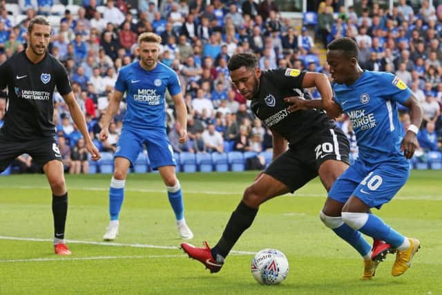 Posh winger Siriki Dembele takes on Portsmouth's Nathan Thormpson. Photo: Joe Dent/theposh.com.