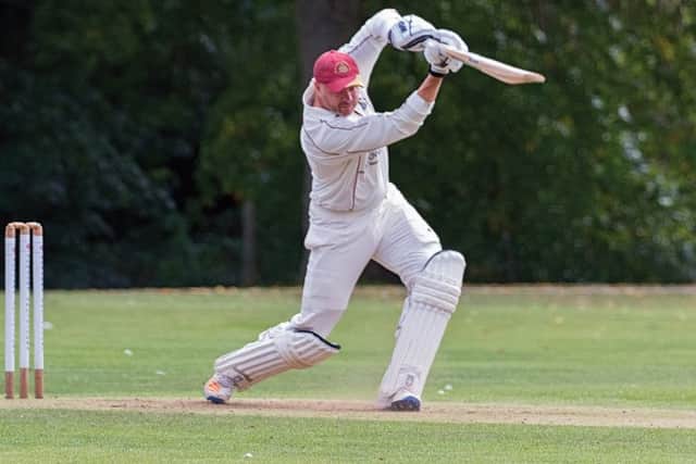 A lovely cover drive from James Harradine during his ton for March against Waresley. Photo: Pat Ringham.