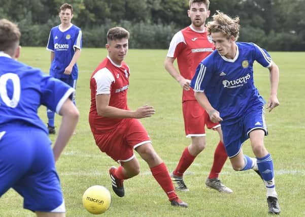 Action from LImetree's (blue) 5-0 win over Hampton Reserves in Peterborough League Division Five. Photo: David Lowndes.