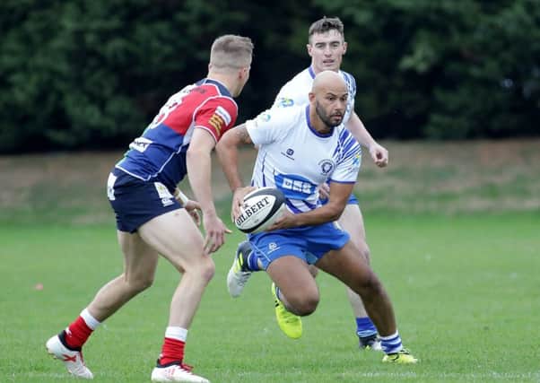 Shaquille Meyers attempts to make a break for the Lions against Hull Ionians. Picture: Mick Sutterby