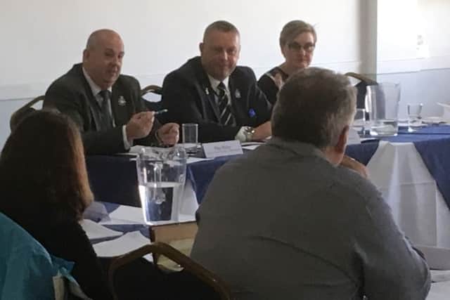 Jason Ablewhite (centre) addresses the panel