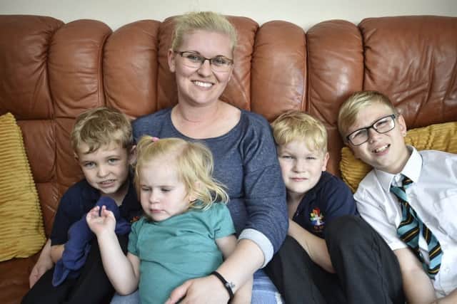 St Michael's Gate resident Jemma Barron with her children Alicia (2), Malakye (5), Jaxon-Joe (6) and John (11). EMN-180918-091313009