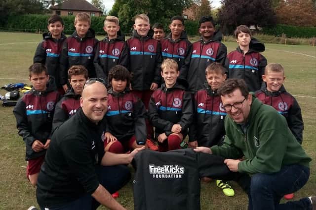 Thorpe Wood Rangers Under 12s are pictured receiving rain jackets from Steve Thorpe of sponsors FreeKicks Foundation before a 4-2 win over Blackstone in a Peterborough Junior Alliance Under 12 Divison Four game.