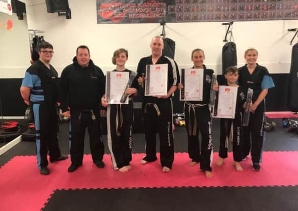 Pictured are the new Hicks Karate School of Excellence black belts with instructors. From the left are Thomas Malkin, Andrew Hicks, Izzy Ramsden, David Cairns, Sarah Ward, Denas Jankauskas and Atlanta Hickman.