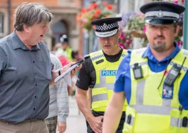 Chief Constable Bill Skelly (centre) has warned of 'stark choices' ahead.